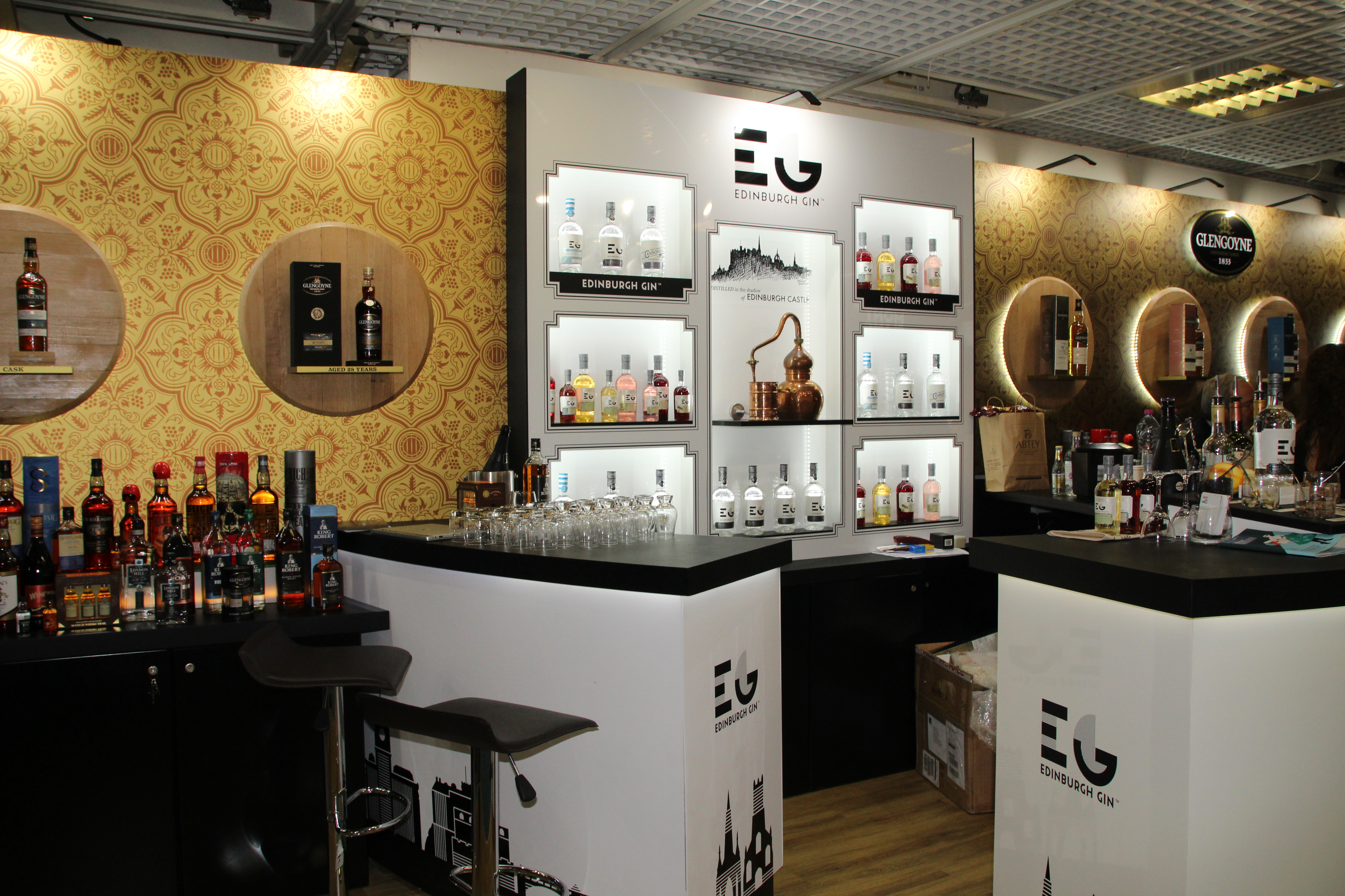whisky exhibition stand with many different types of whisky on display