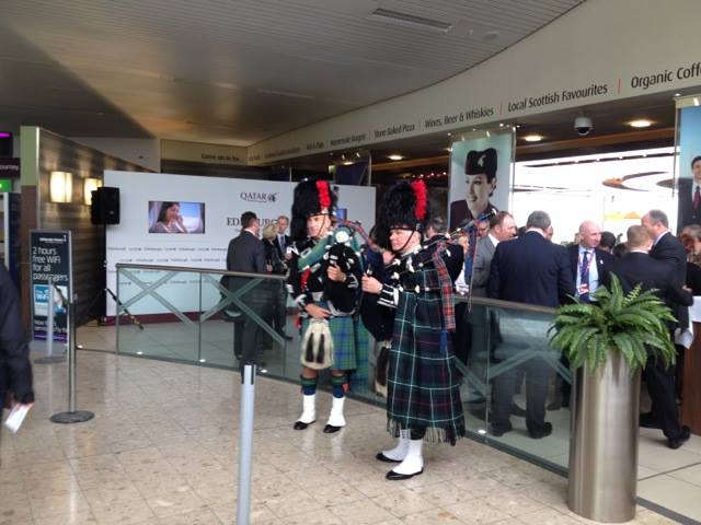 qatar airlines comes to edinburgh - 2 pipers in the foreground