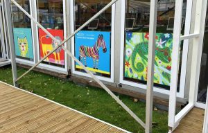 colourful drawings of animals in the window