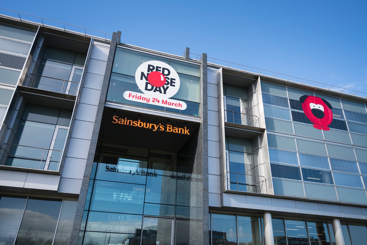 entrance to the sainsburys bank with comic relief red nose characters showing