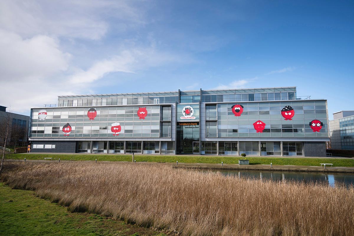 view of the sainsburys bank with comic relief red nose characters all over the front