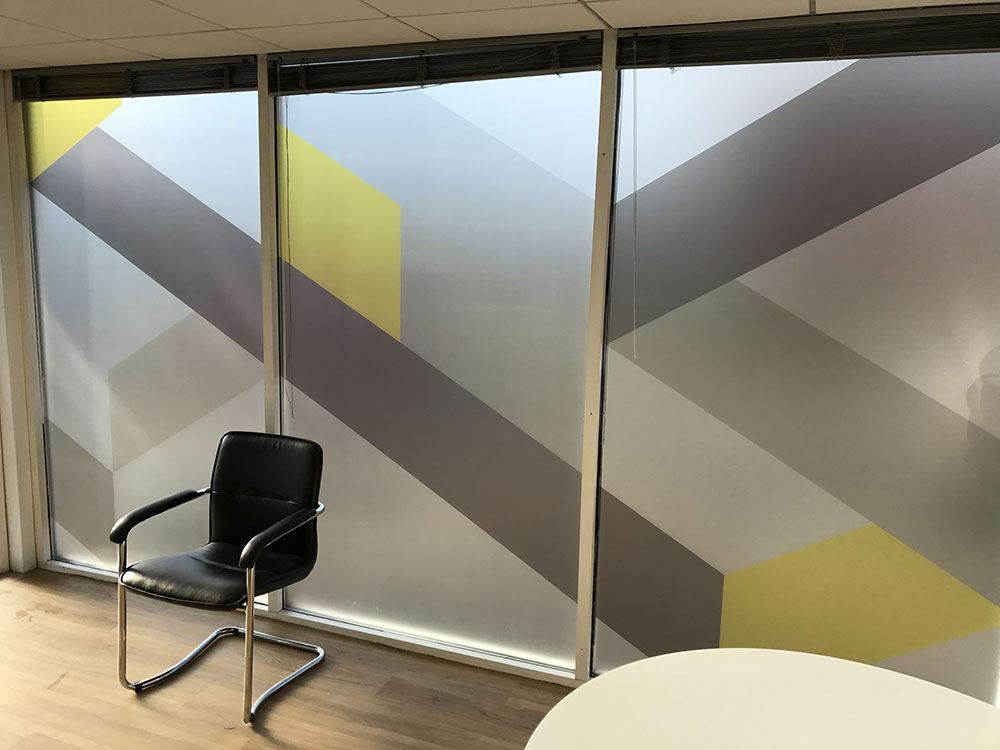 window graphics and a single black chair in view
