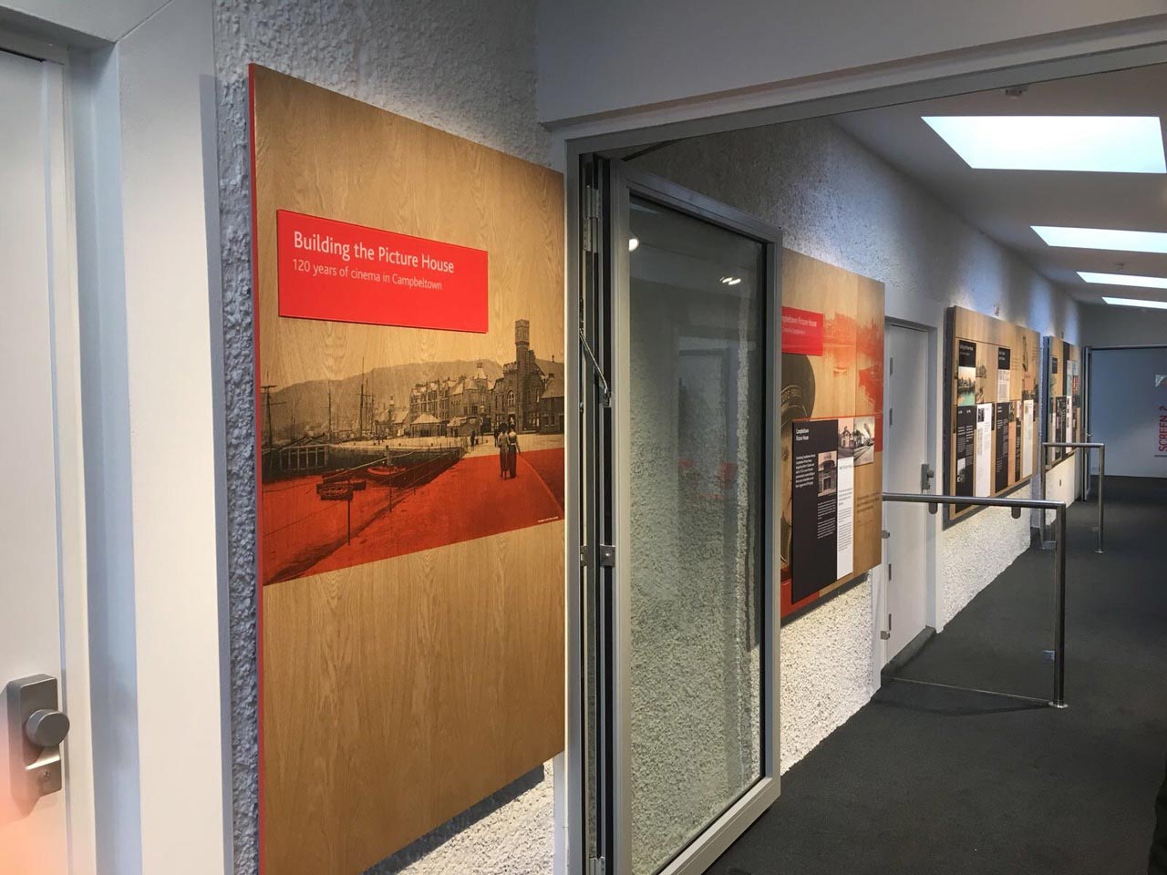 corridor with boards on the wall with info about the campbeltown picture house