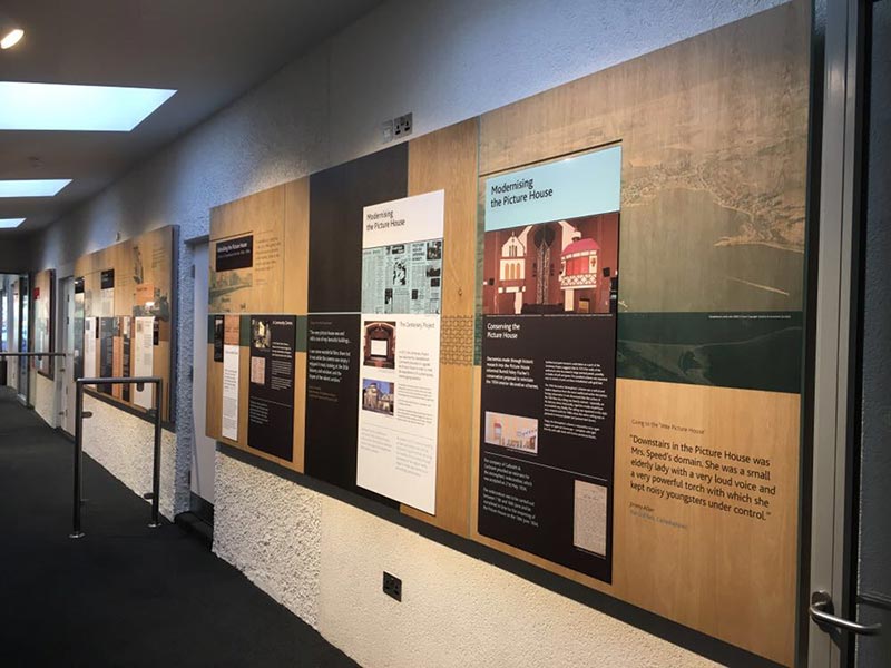 corridor with boards on the wall with info about the campbeltown picture house