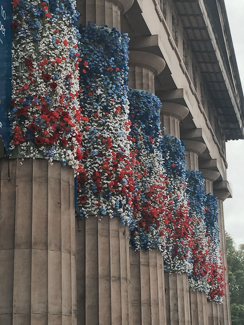 flowers attached to the pillars of the scottish national gallery