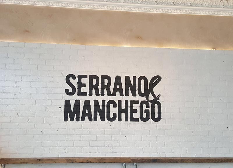 serrano manchego message on the wall