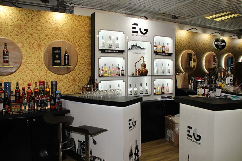 Edinburgh gin exhibition stand with bottles and glass displays