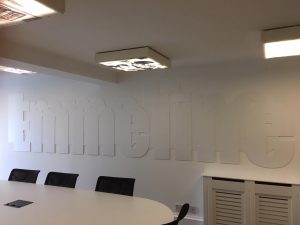 Office Interiors - meeting room with the sing emmeline on the wall