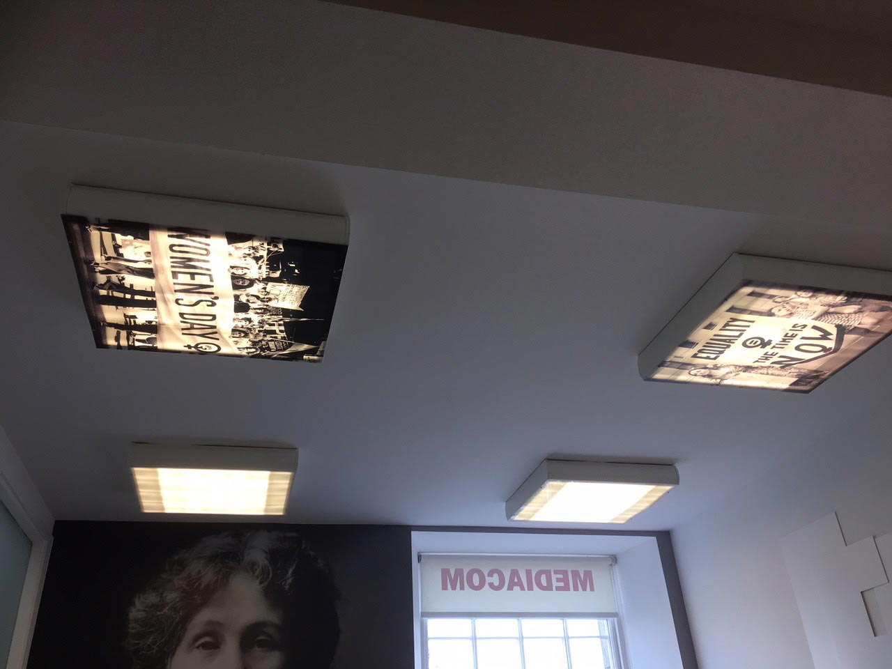 Office Interiors - light boxes on the ceiling with pictures