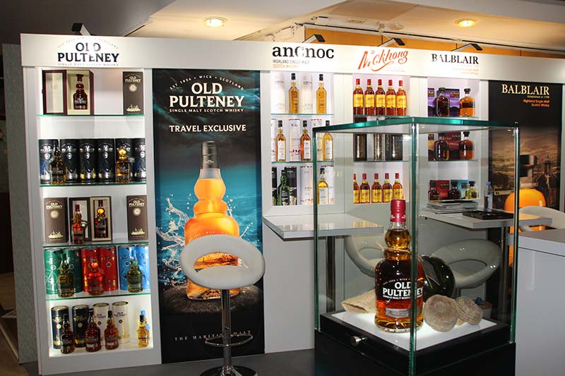 old pulteney whisky exhibition stand with a selection of whiskies on display