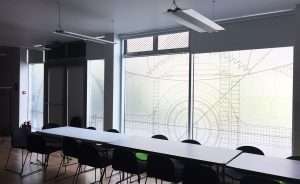 geometric shapes on a window inside a meeting room
