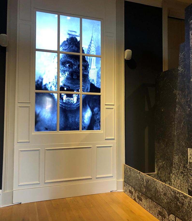 king kong in the window of a door