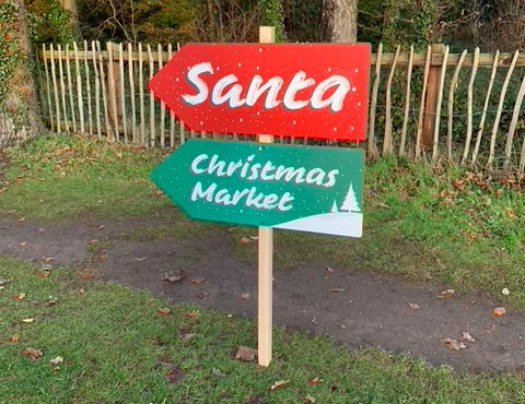 santa and christmas market directional signs