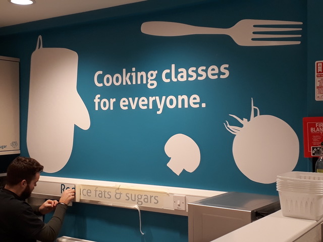 painted wall with message - cooking classes for everyone.