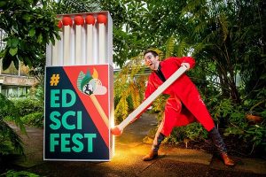 edinburgh science festival giant matchbox with man trying to light a match